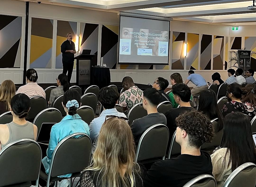 Dr Dinos Kountouras lecturing on full-mouth rehabilitation